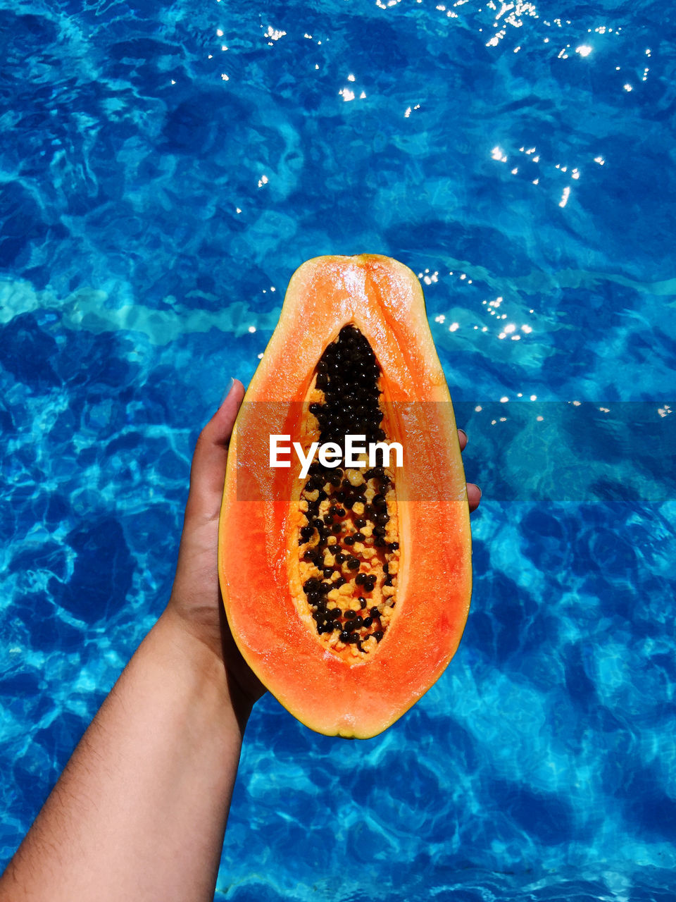 Summer, papaya and pool.