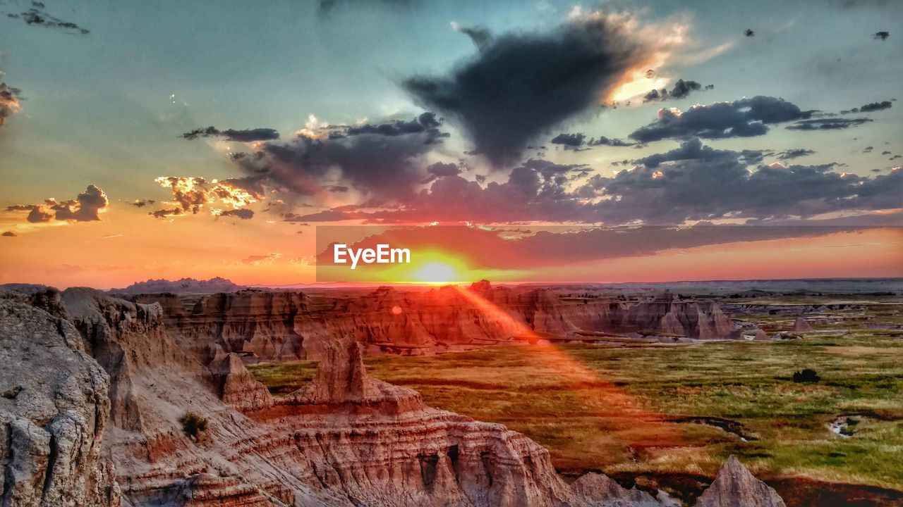 Scenic view of landscape against sky during sunset