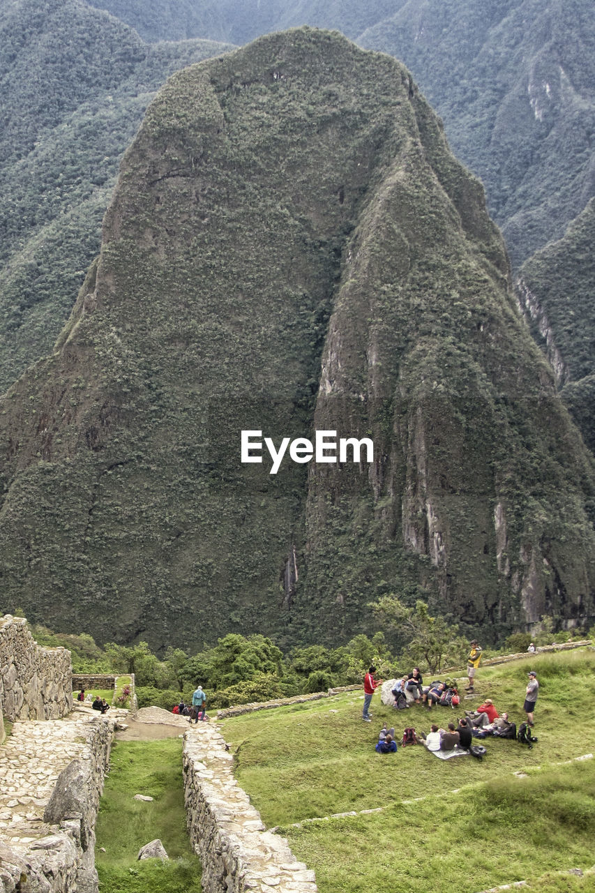 PEOPLE SITTING ON LANDSCAPE