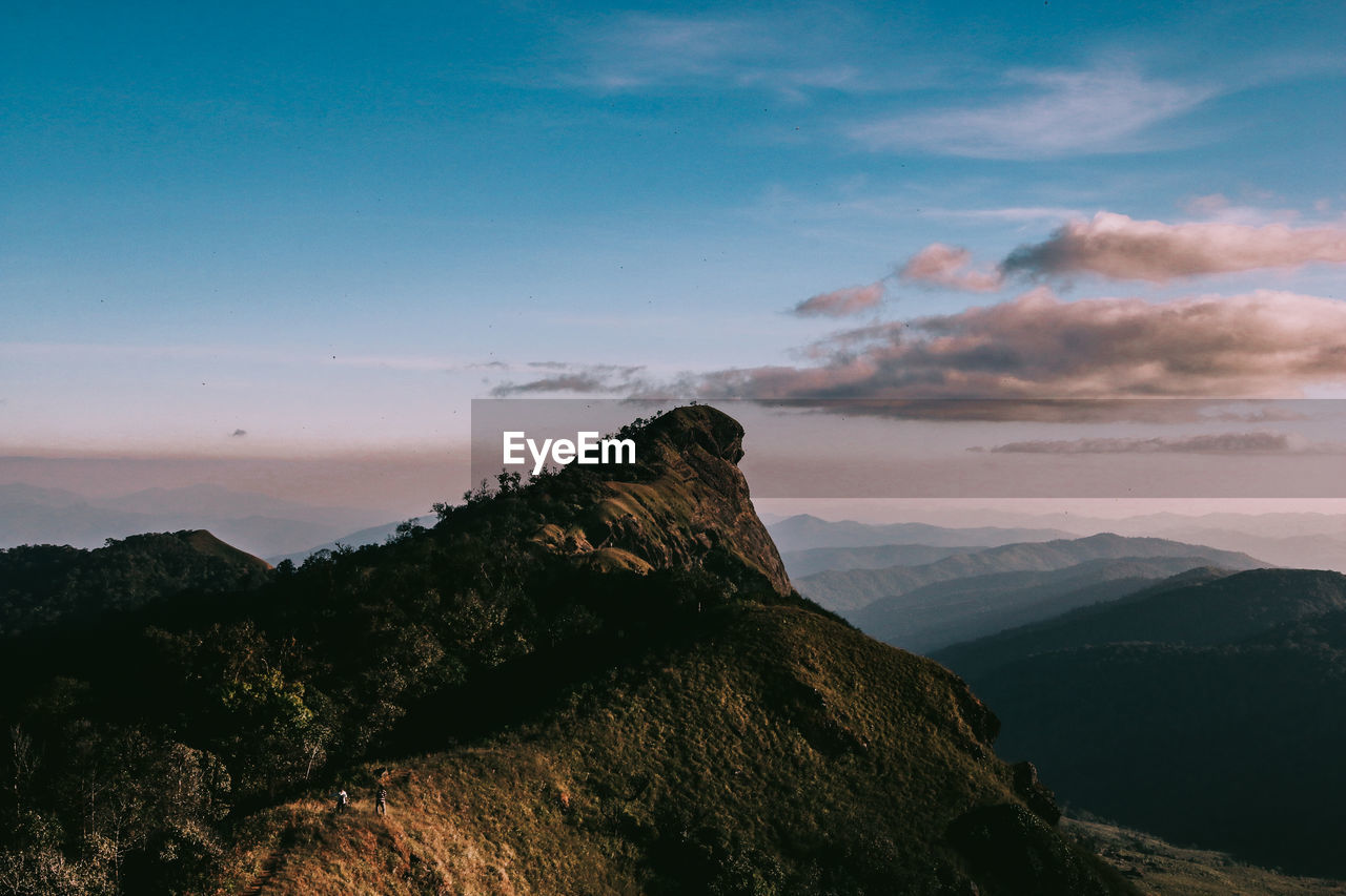 Scenic view of mountains against sky at sunset