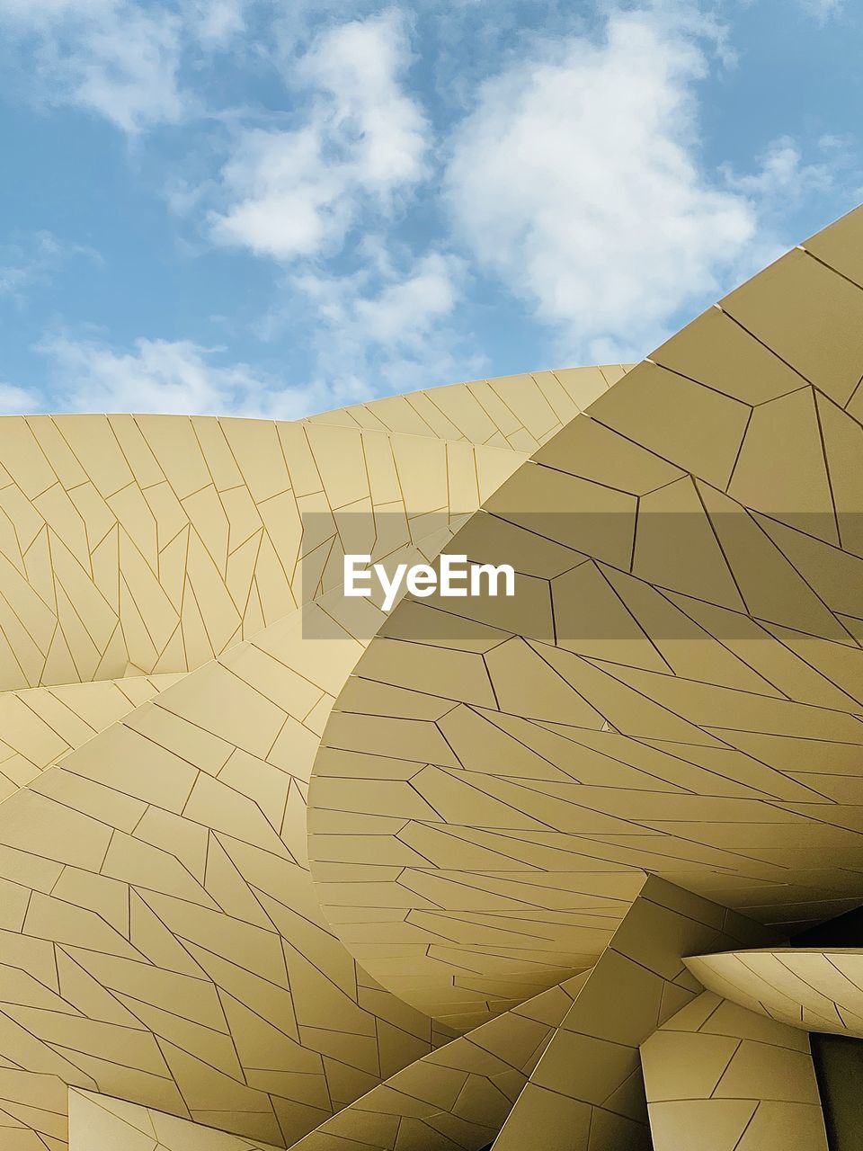 LOW ANGLE VIEW OF ROOF AGAINST BLUE SKY