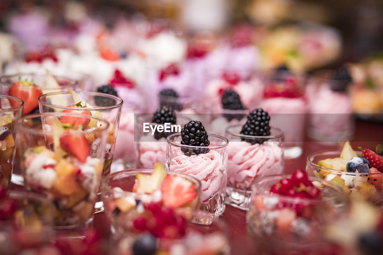 Close-up of desserts in glasses on table