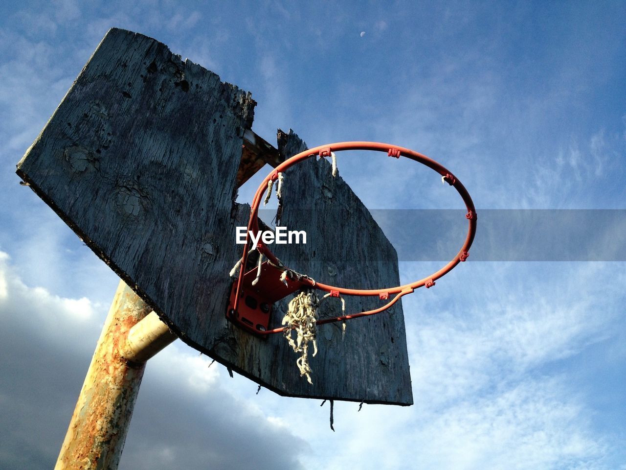 Low angle view of damaged basketball hoop