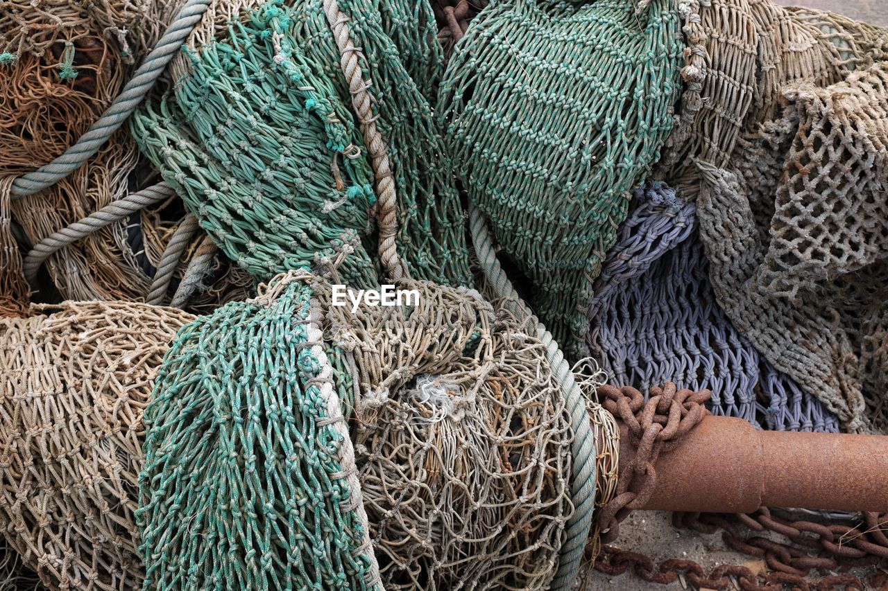 High angle view of fishing net in boat