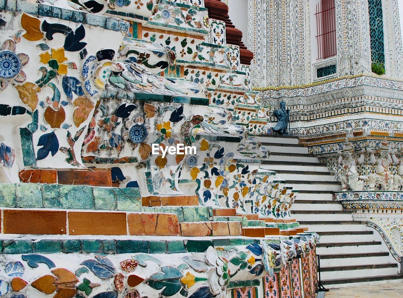 Low angle view of ceramic pattern on wall of building