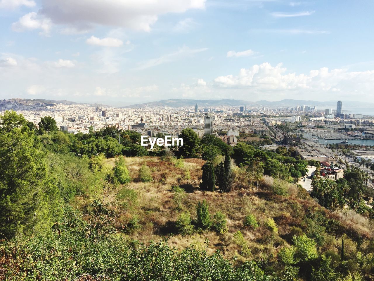 Scenic view of residential district against sky