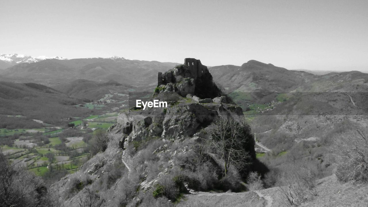 SCENIC VIEW OF MOUNTAINS AGAINST CLEAR SKY