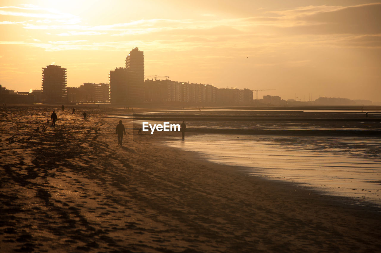 Scenic view of beach against sky during sunset