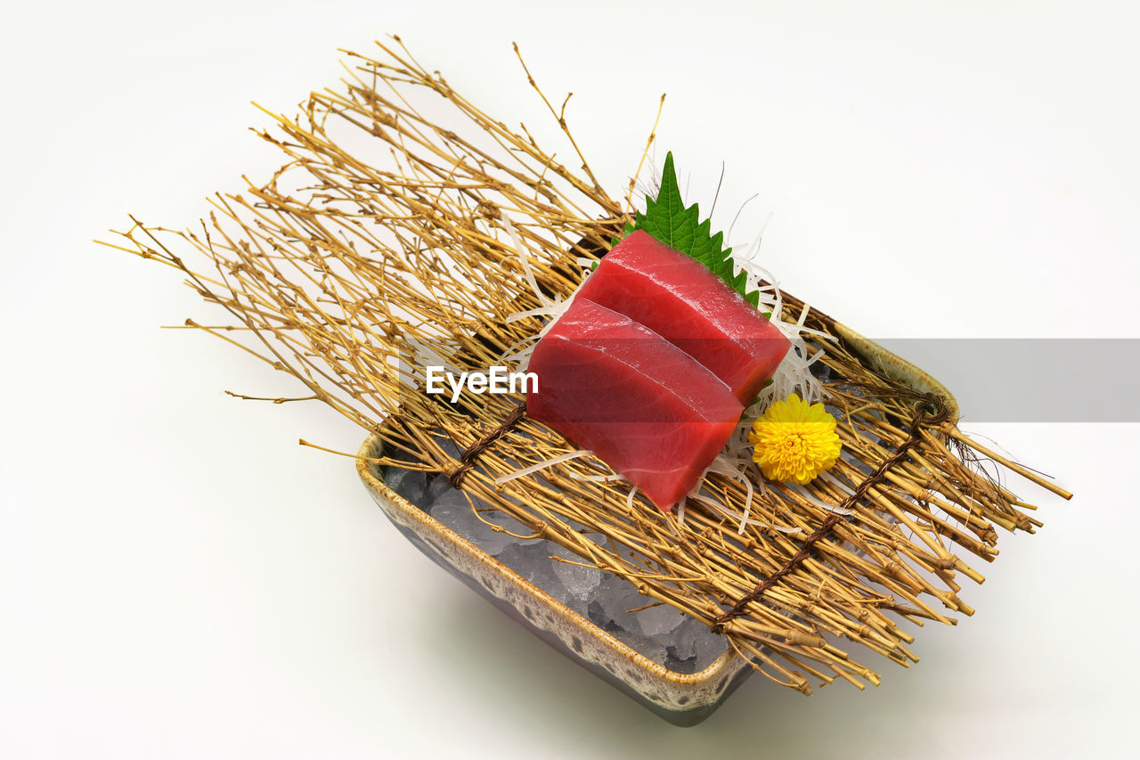 CLOSE-UP OF RED CHILI PEPPERS IN BASKET