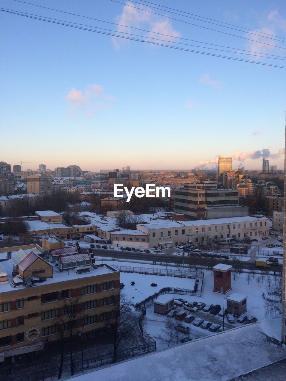 HIGH ANGLE VIEW OF HOUSES IN WINTER