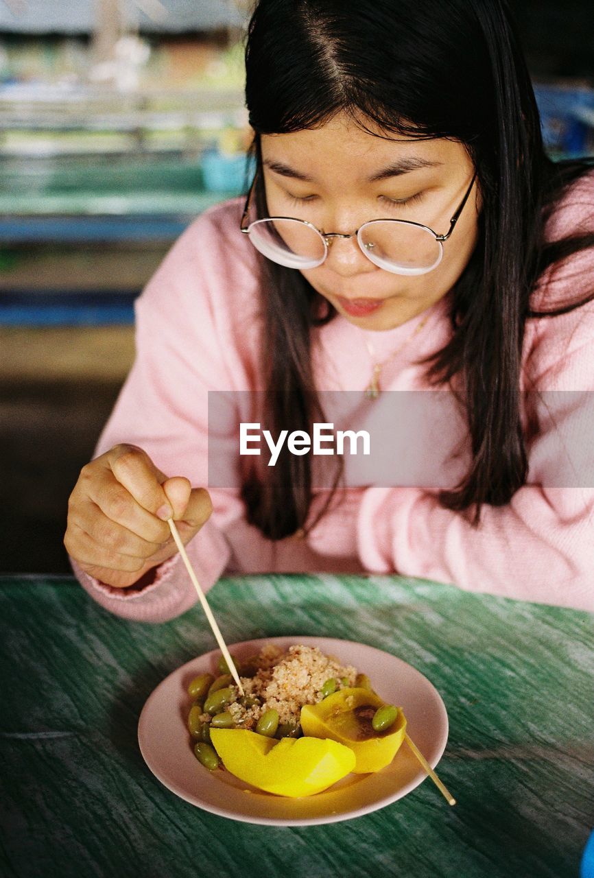 Portrait of woman having food