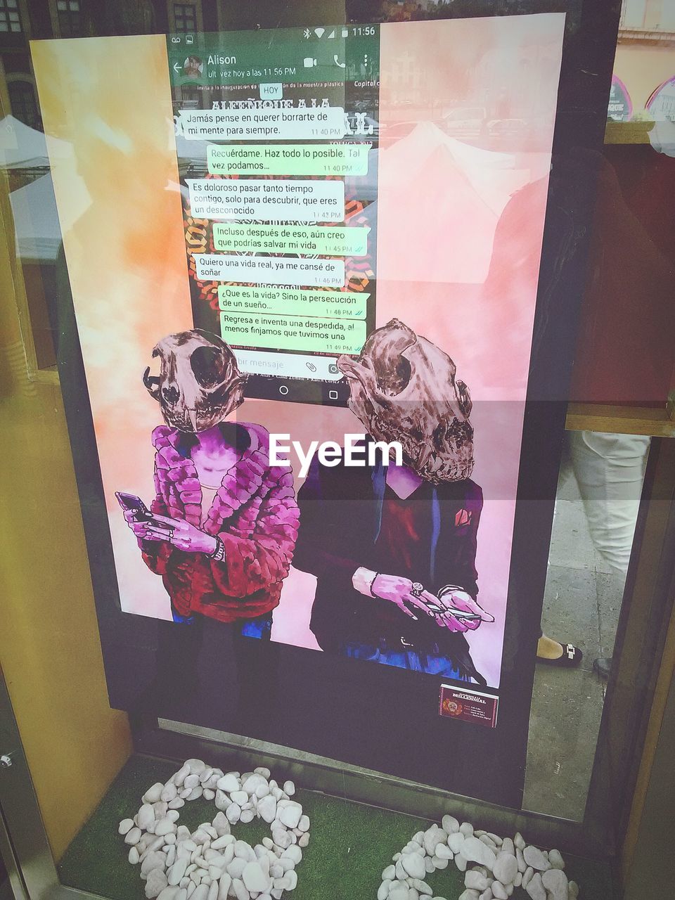 MAN WITH UMBRELLA IN STORE SEEN FROM WINDOW