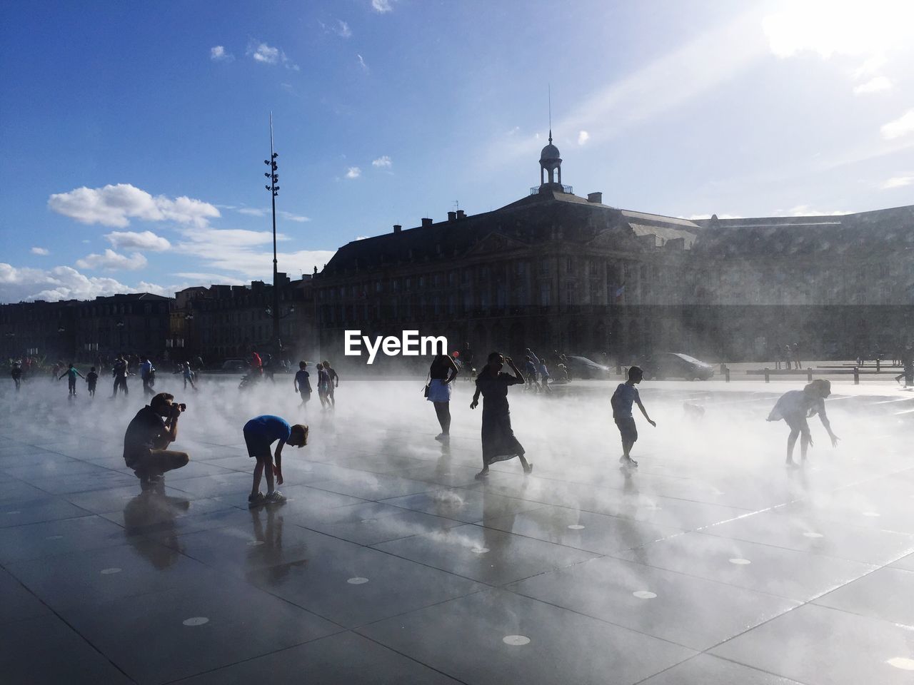 People at town square against sky