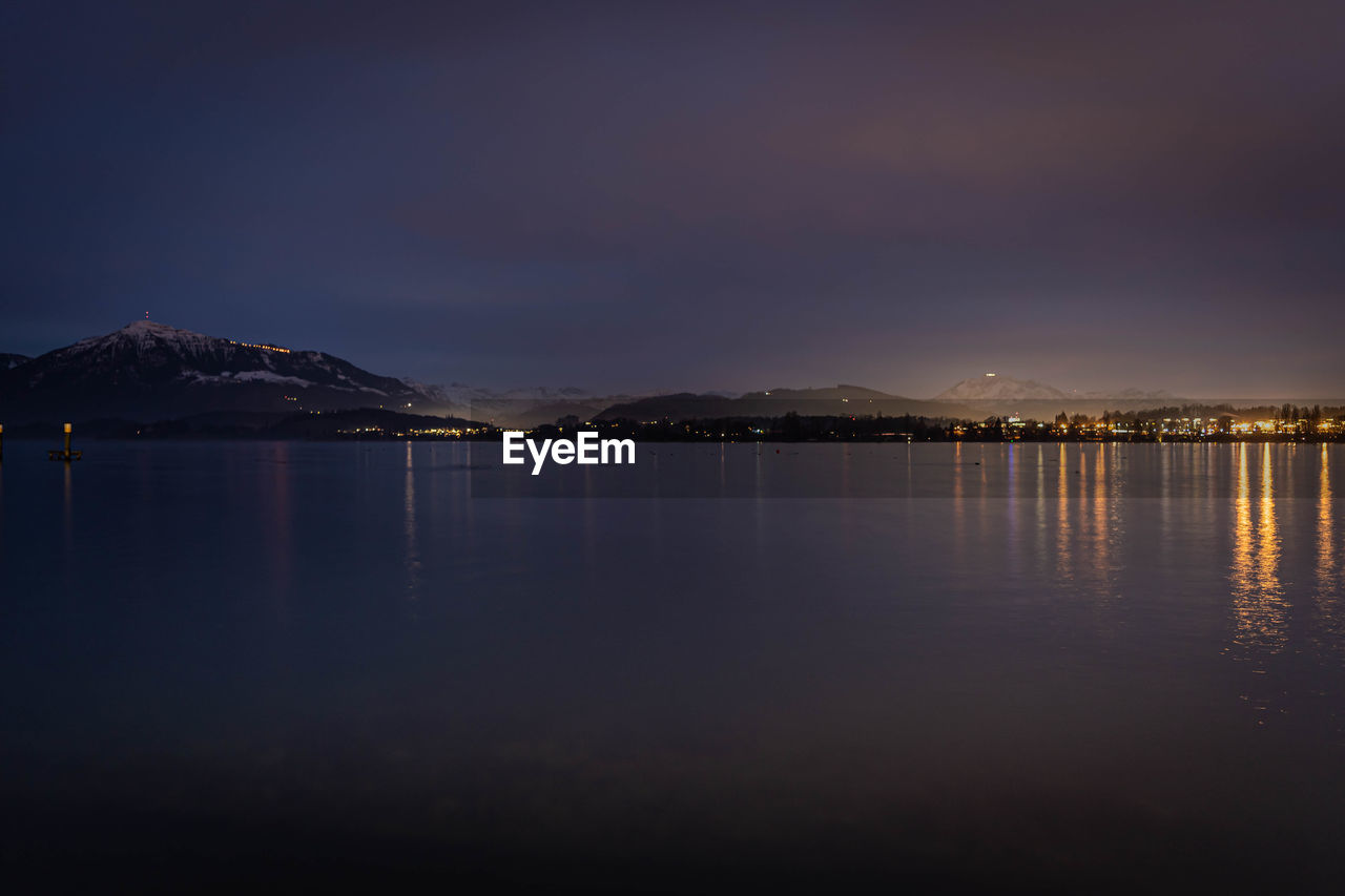 Scenic view of sea against sky at night lake of zug with rigi and pilatus 