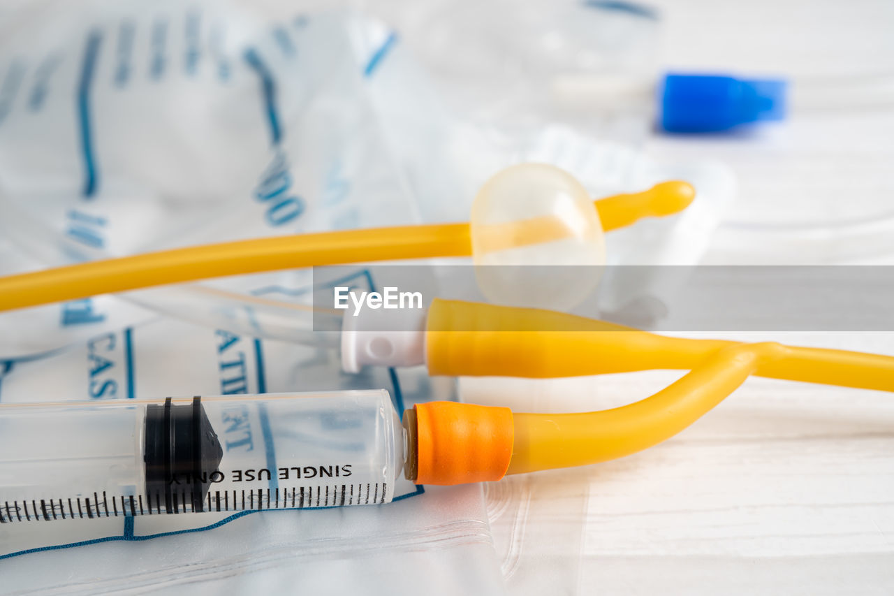 healthcare and medicine, medicine, indoors, sharp, medical supplies, medical equipment, needle, syringe, close-up, science, research, no people, care, yellow, medical, dose, equipment, occupation, plastic