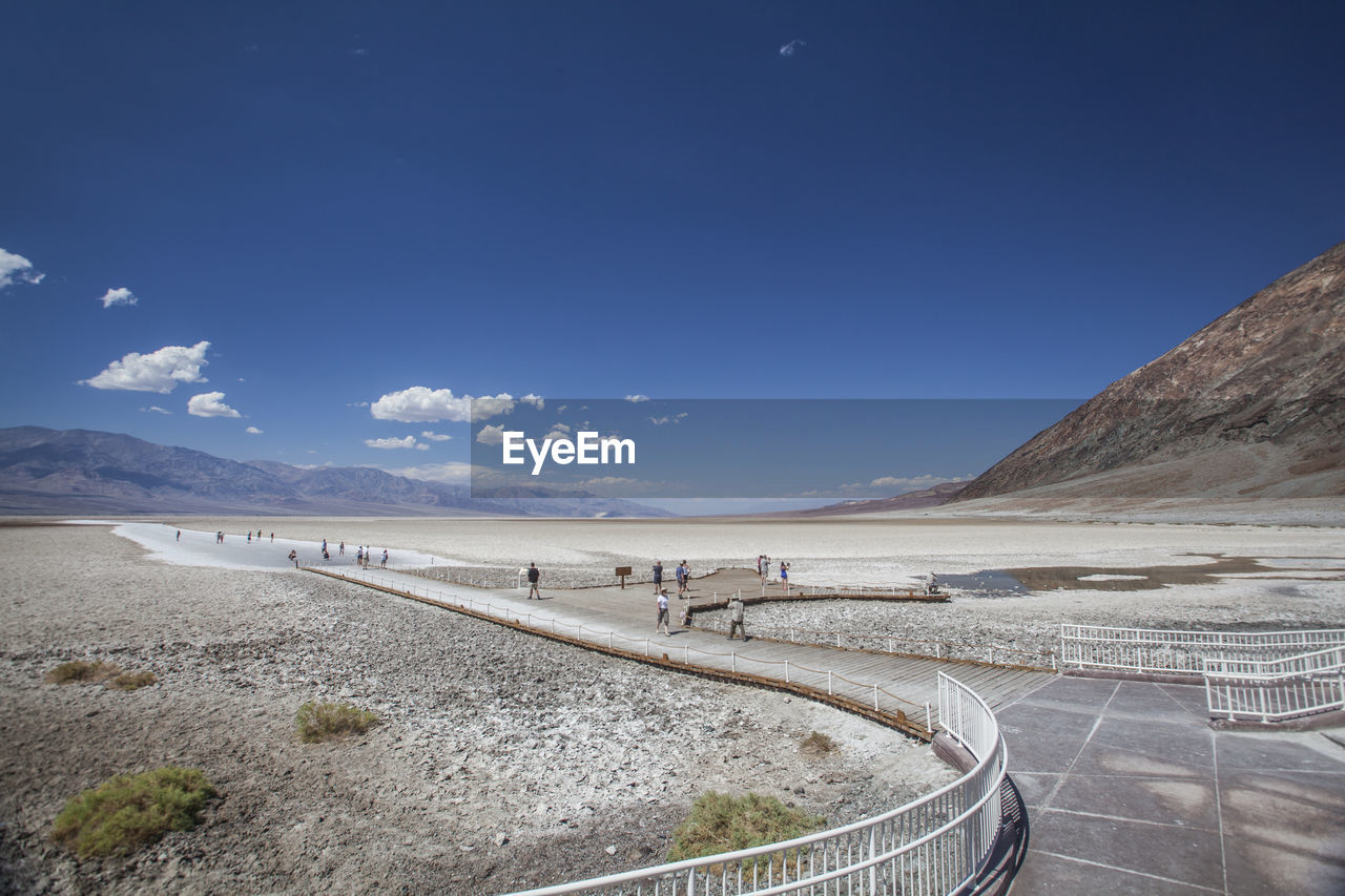 PANORAMIC VIEW OF ROAD BY LAND AGAINST SKY