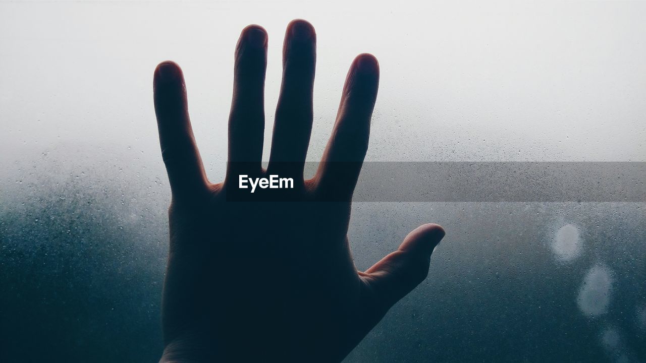 Woman shadow on hand