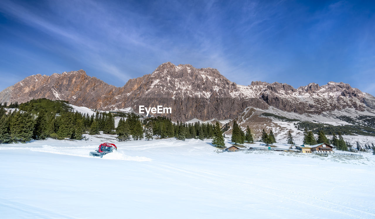 Snowplough in winter landscape