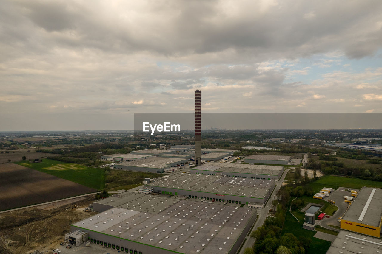 Warehouse halls, logistics, black clouds, aerial photo, chimney, chp plant