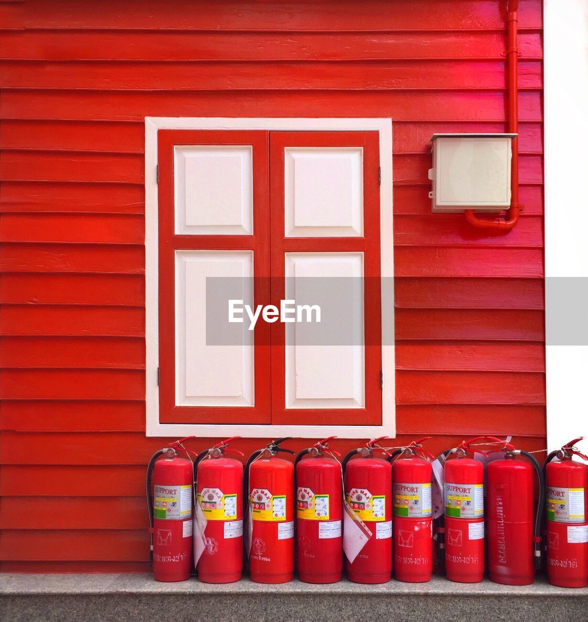 Fire extinguishers on retaining wall by