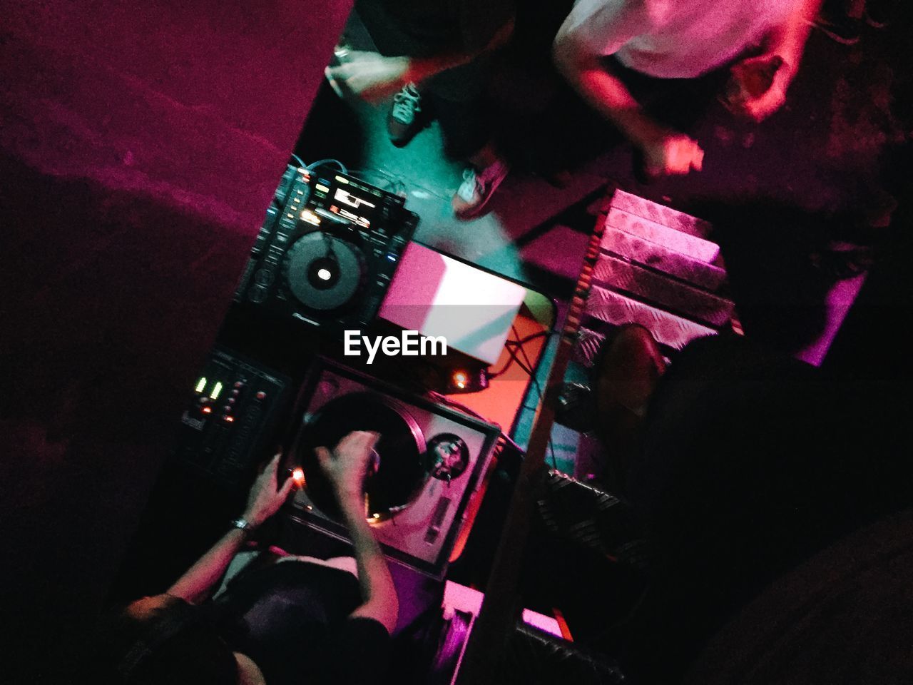 High angle view of person at mixing desk in party
