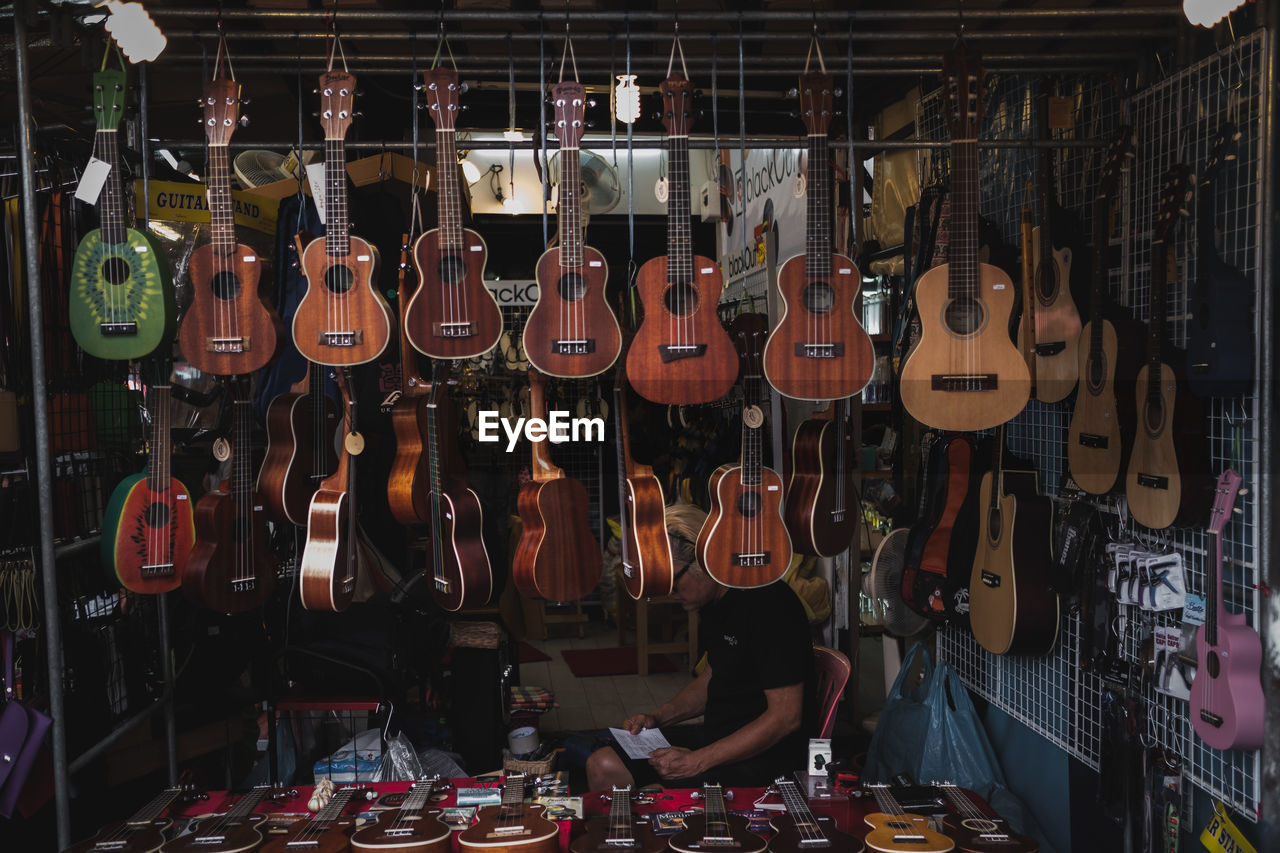 String instruments hanging in store