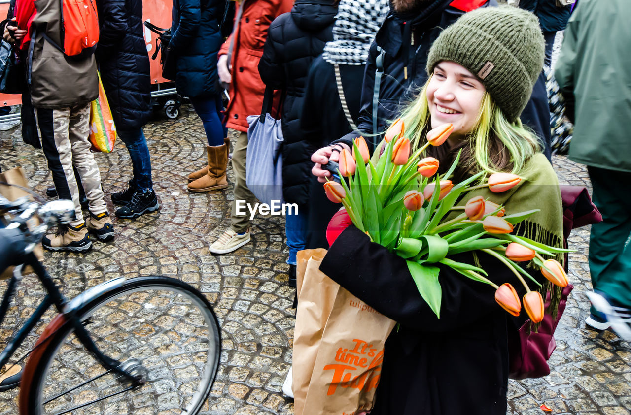 PEOPLE STANDING IN MARKET