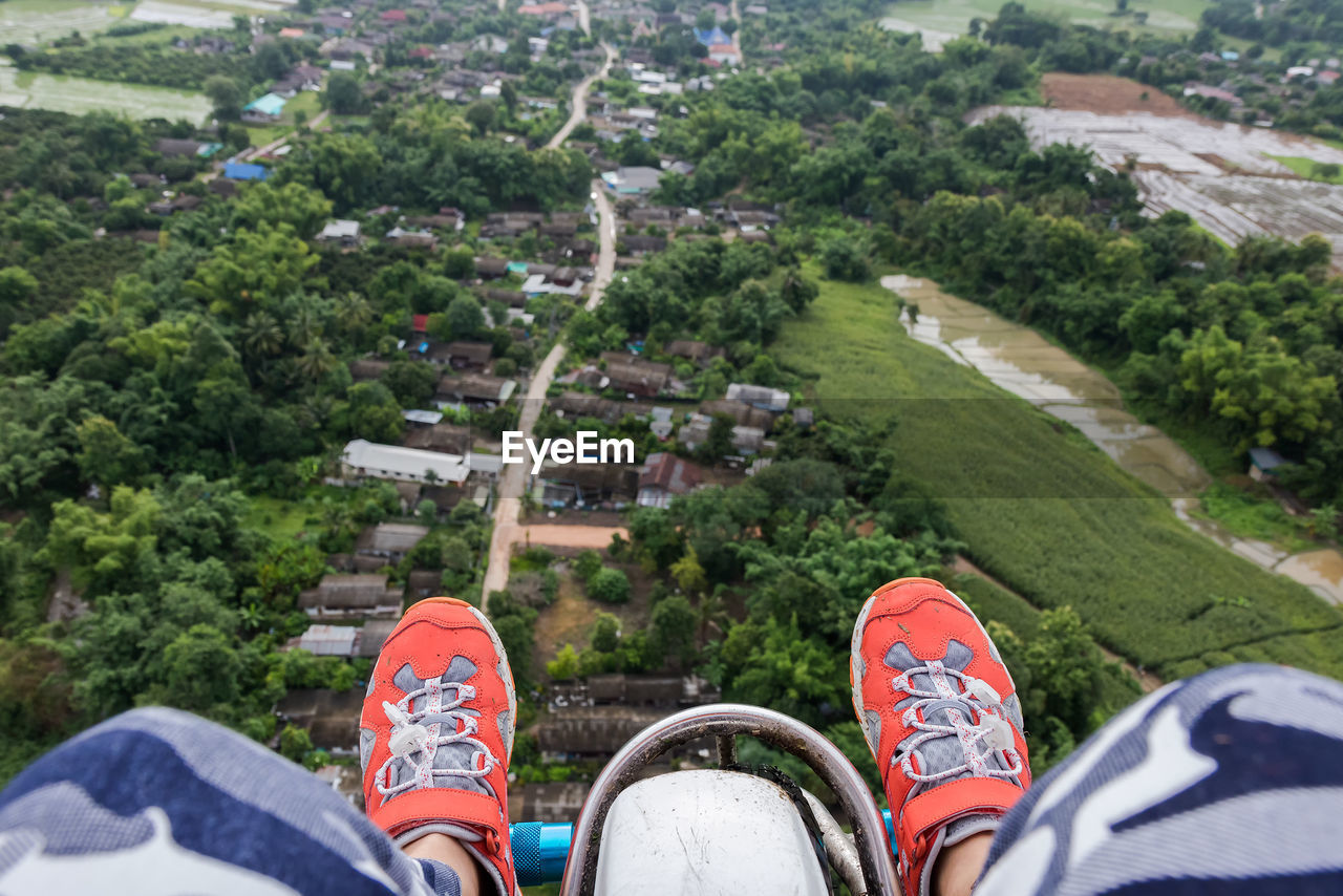 Low section of person over landscape