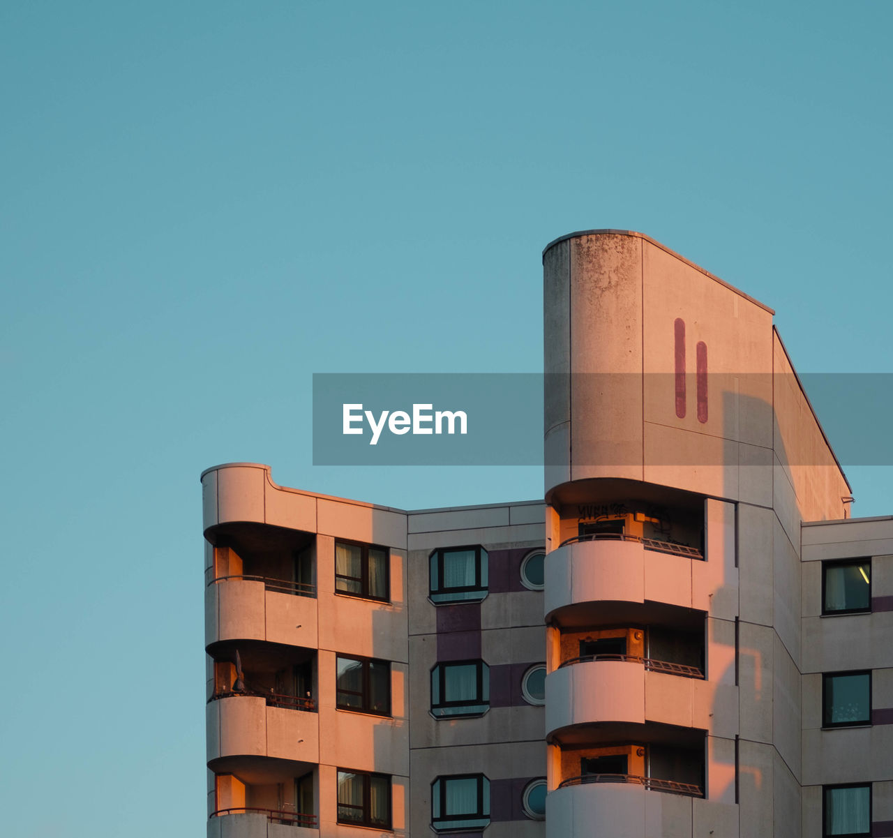 Low angle view of raw building against clear sky