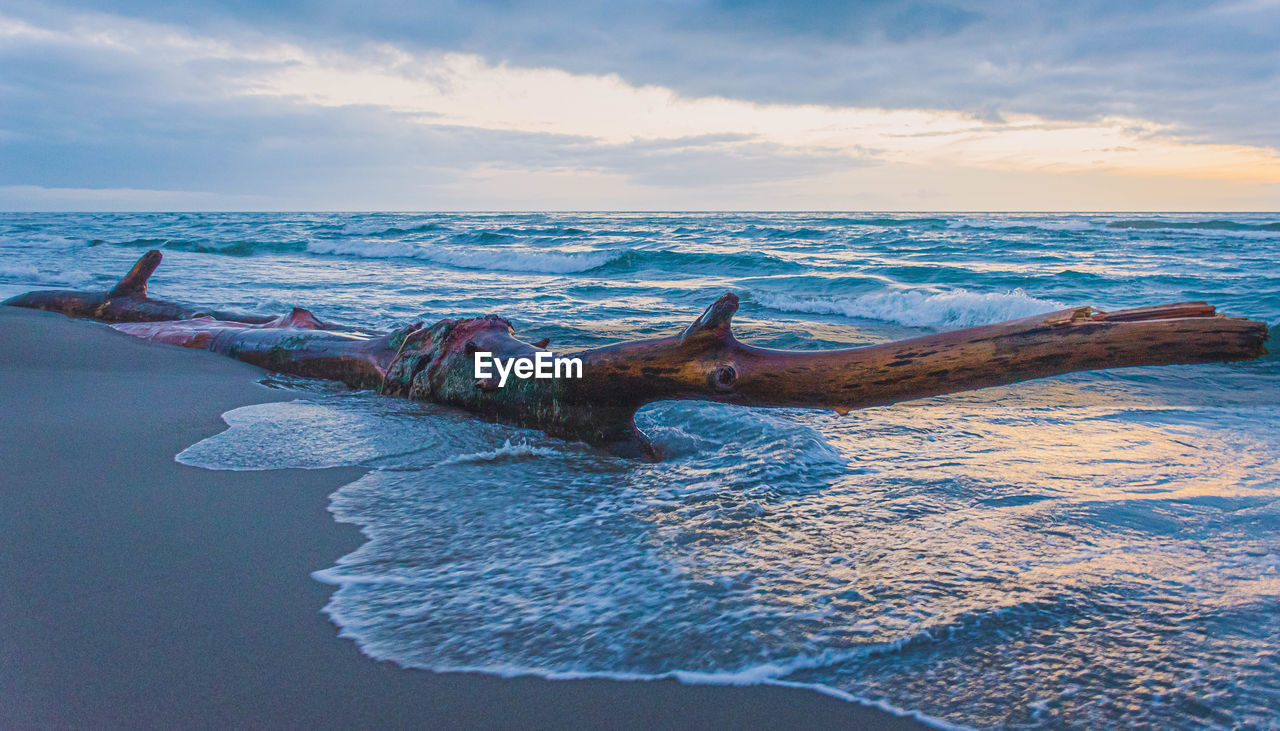 SCENIC VIEW OF SEA DURING SUNSET