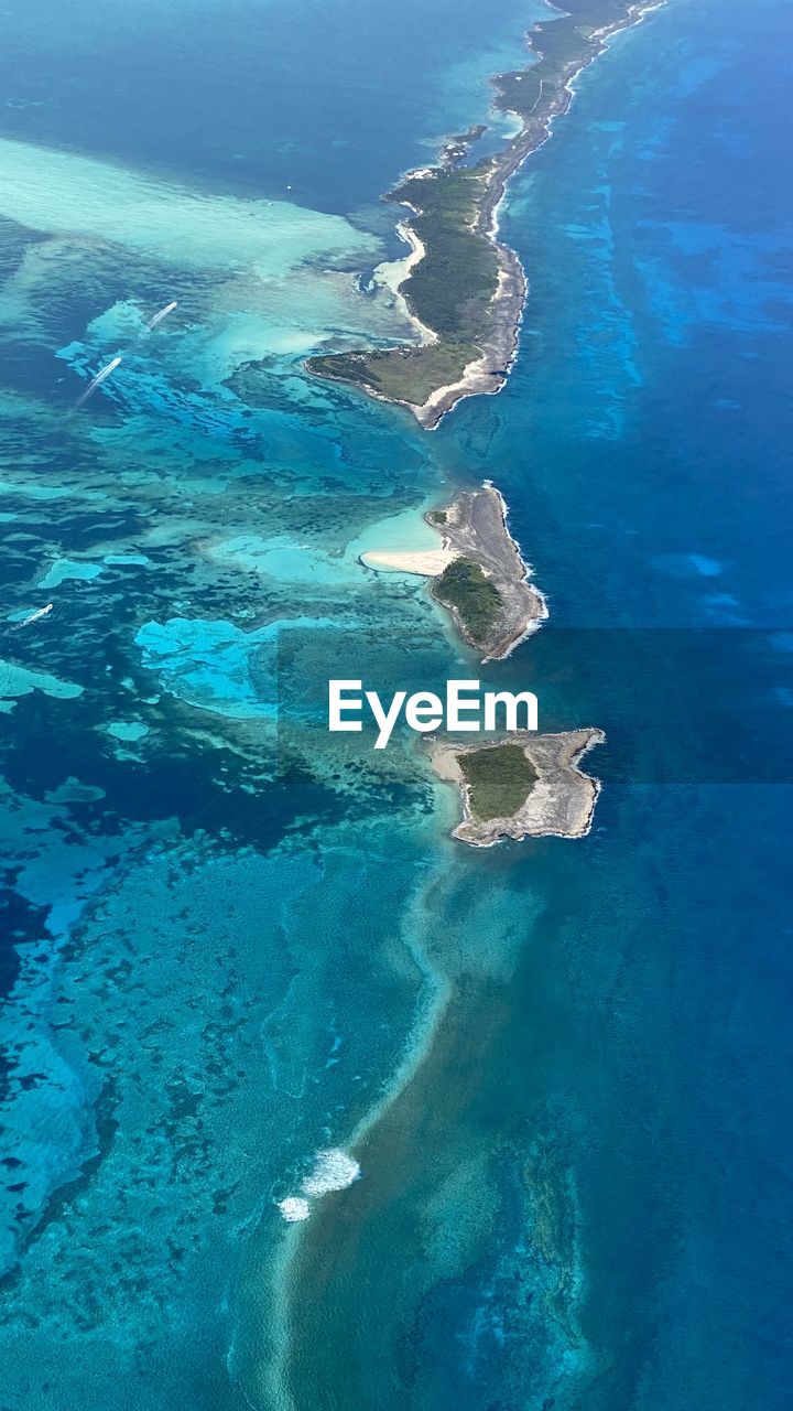 water, sea, ocean, land, archipelago, beach, scenics - nature, nature, aerial view, beauty in nature, blue, coast, atoll, islet, island, no people, environment, wind wave, travel destinations, high angle view, travel, tranquility, outdoors, coastline, landscape, day, idyllic, tranquil scene, reef, lagoon, turquoise colored, bay, azure, tourism