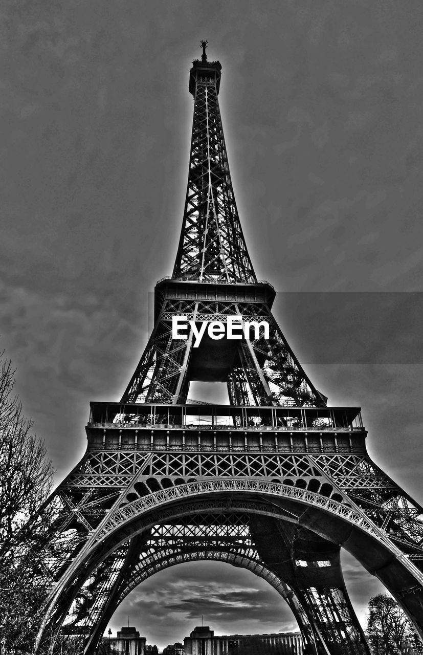 LOW ANGLE VIEW OF EIFFEL TOWER WITH EIFFEL TOWER IN BACKGROUND