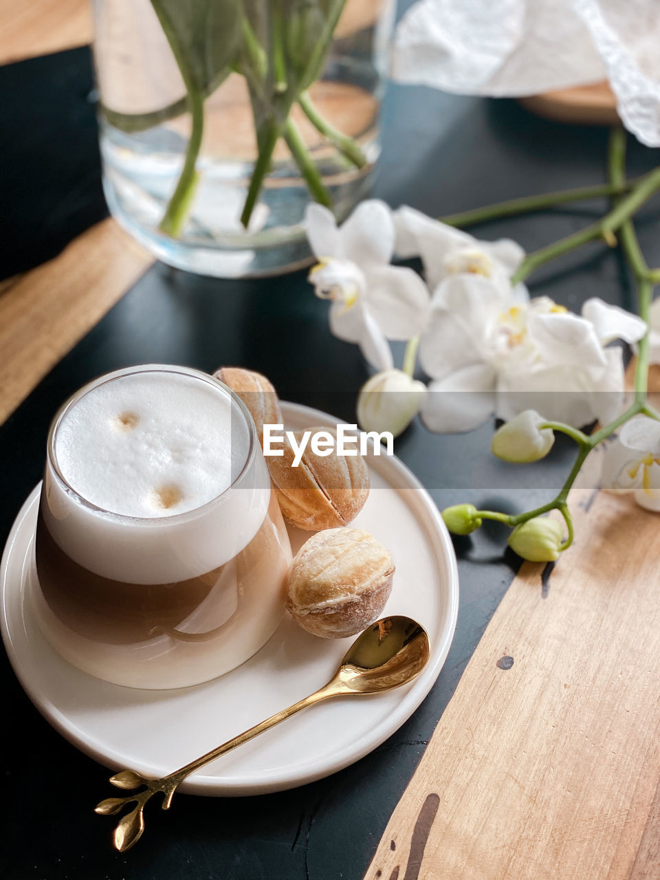 HIGH ANGLE VIEW OF COFFEE SERVED ON TABLE AT CAFE