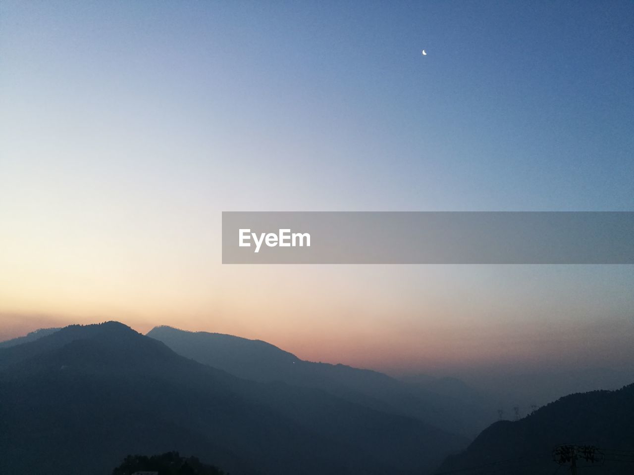 Scenic view of silhouette mountains against clear sky