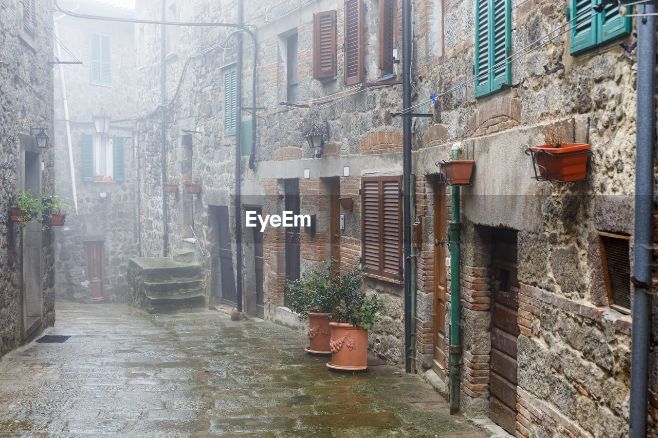 Misty alley in an italian village