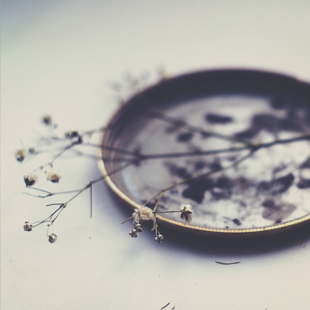 CLOSE-UP OF EYEGLASSES ON FLOOR