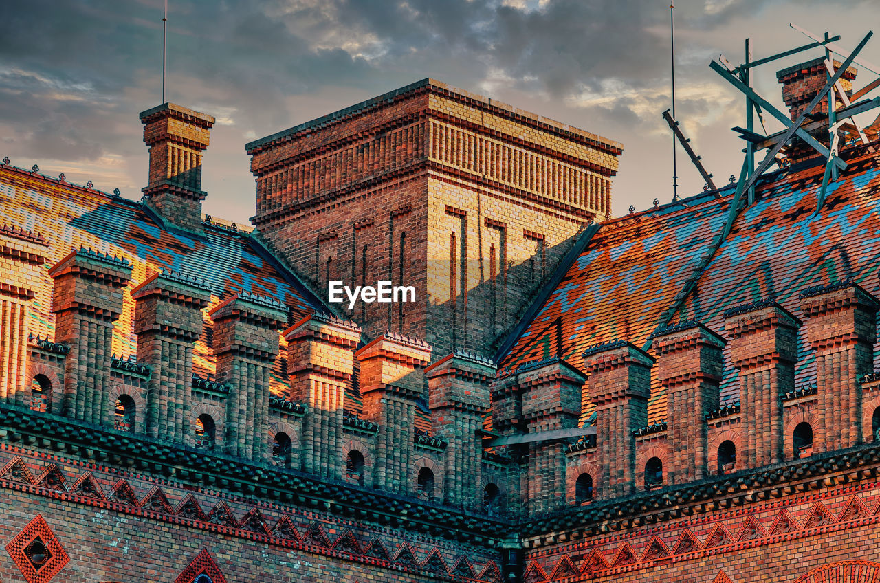 Decorative elements roof of an old house, university in chernivtsi. red brick house