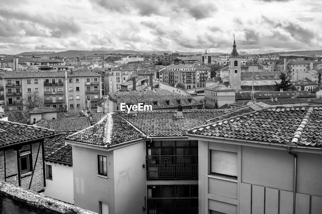 architecture, building exterior, built structure, urban area, building, city, black and white, house, monochrome, cityscape, monochrome photography, cloud, sky, residential district, residential area, roof, nature, no people, high angle view, white, day, outdoors, town, travel destinations, window, neighbourhood
