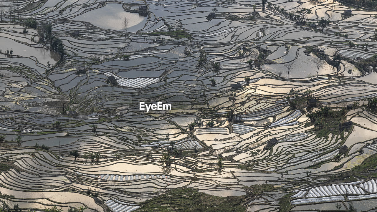 Sunset over yuanyang rice terraces in yunnan, china, one of the latest unesco world heritage sites