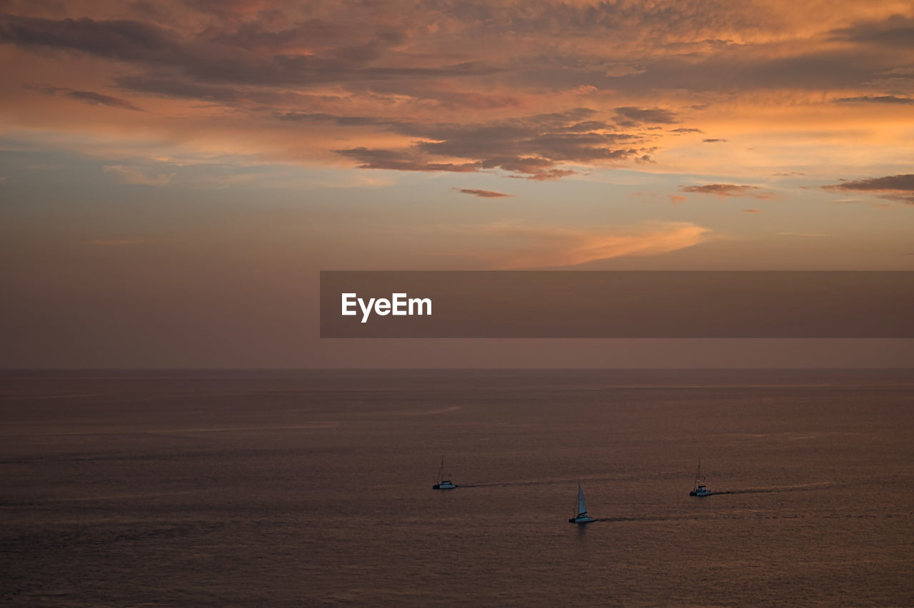 SCENIC VIEW OF SEA DURING SUNSET