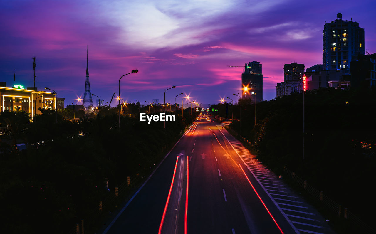 High angle view of light trails on road at night