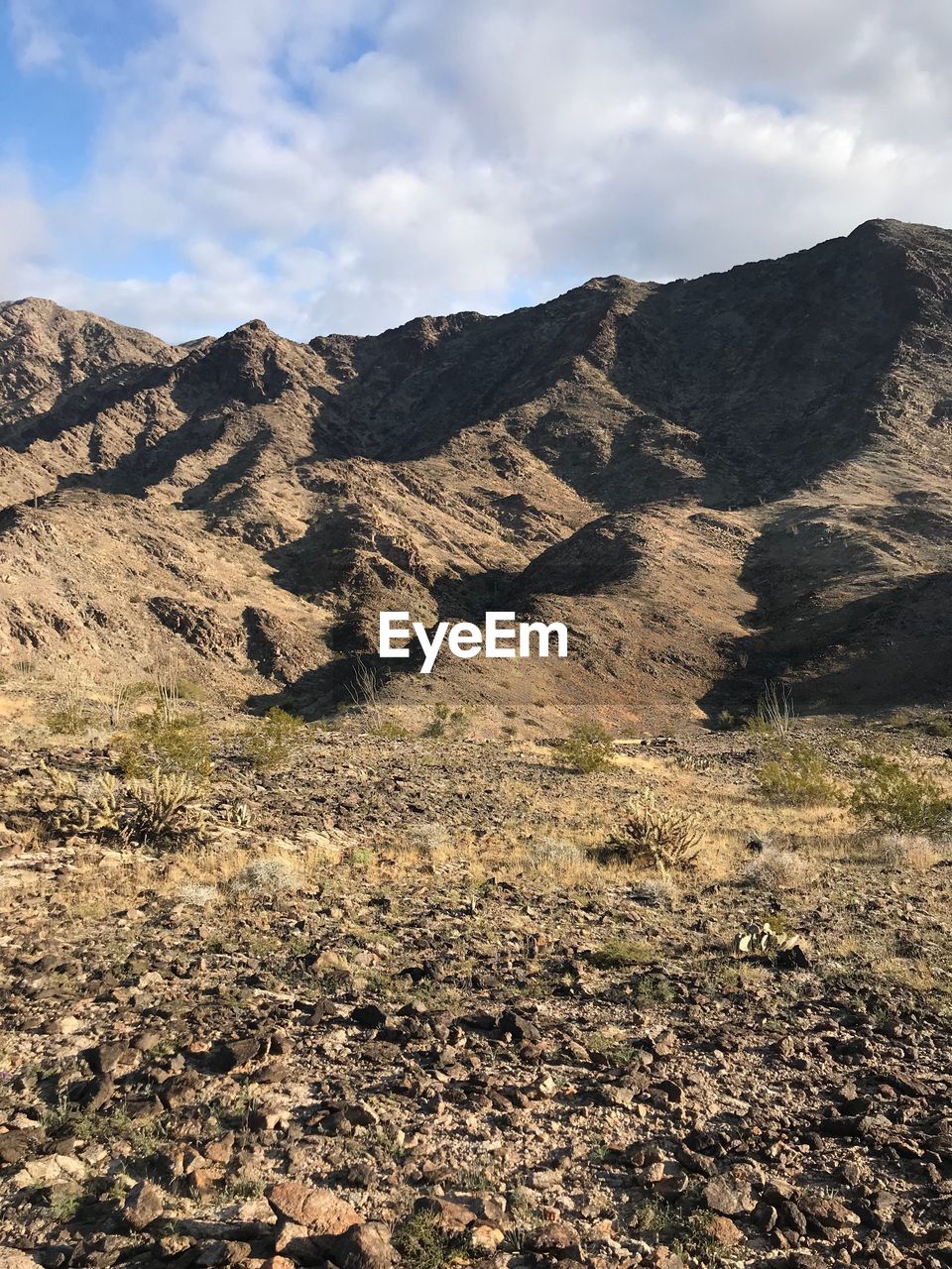 Scenic view of rocky mountains against sky