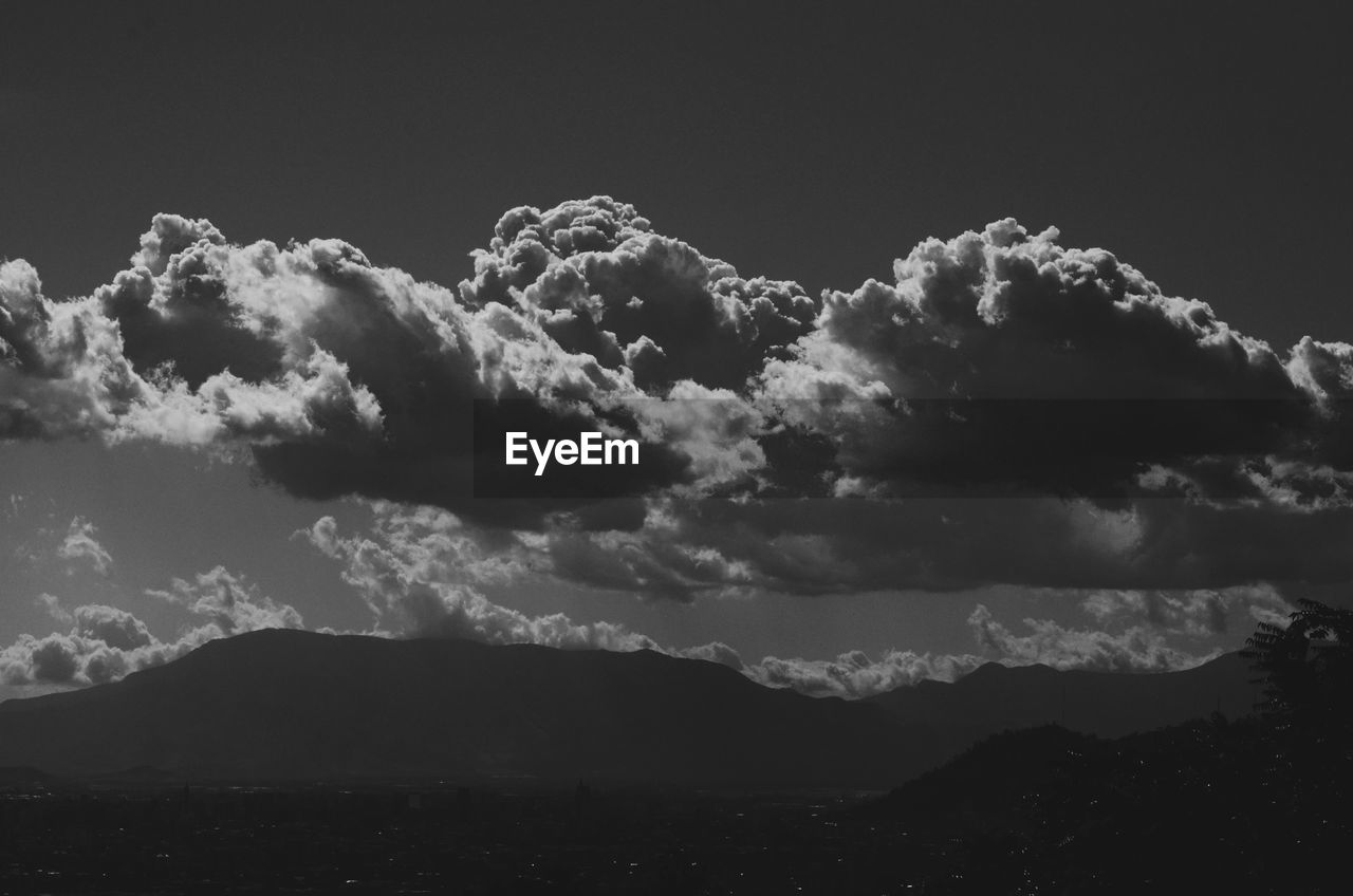 LOW ANGLE VIEW OF SKY AND MOUNTAINS AGAINST THE BACKGROUND