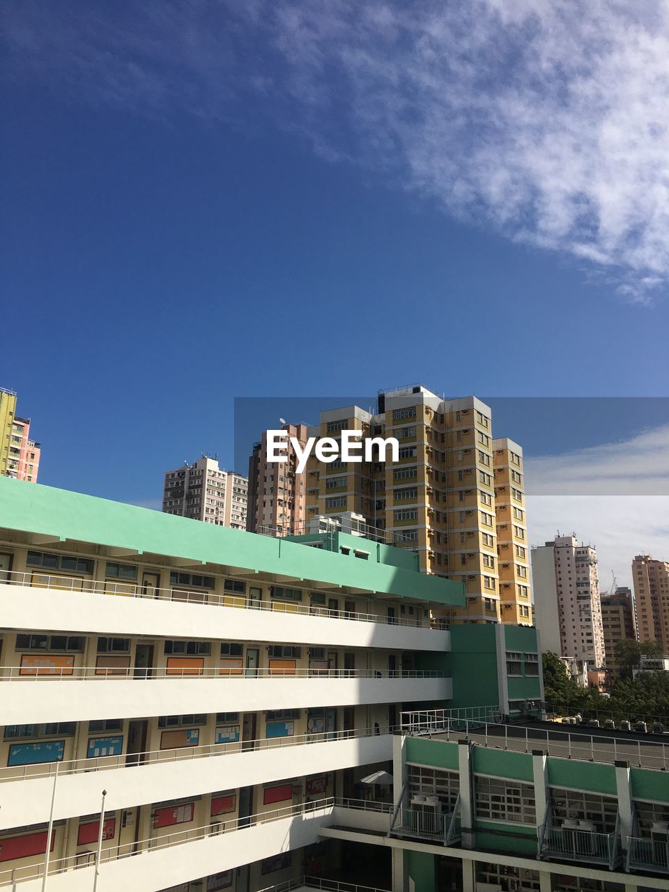 LOW ANGLE VIEW OF BUILDING AGAINST BLUE SKY