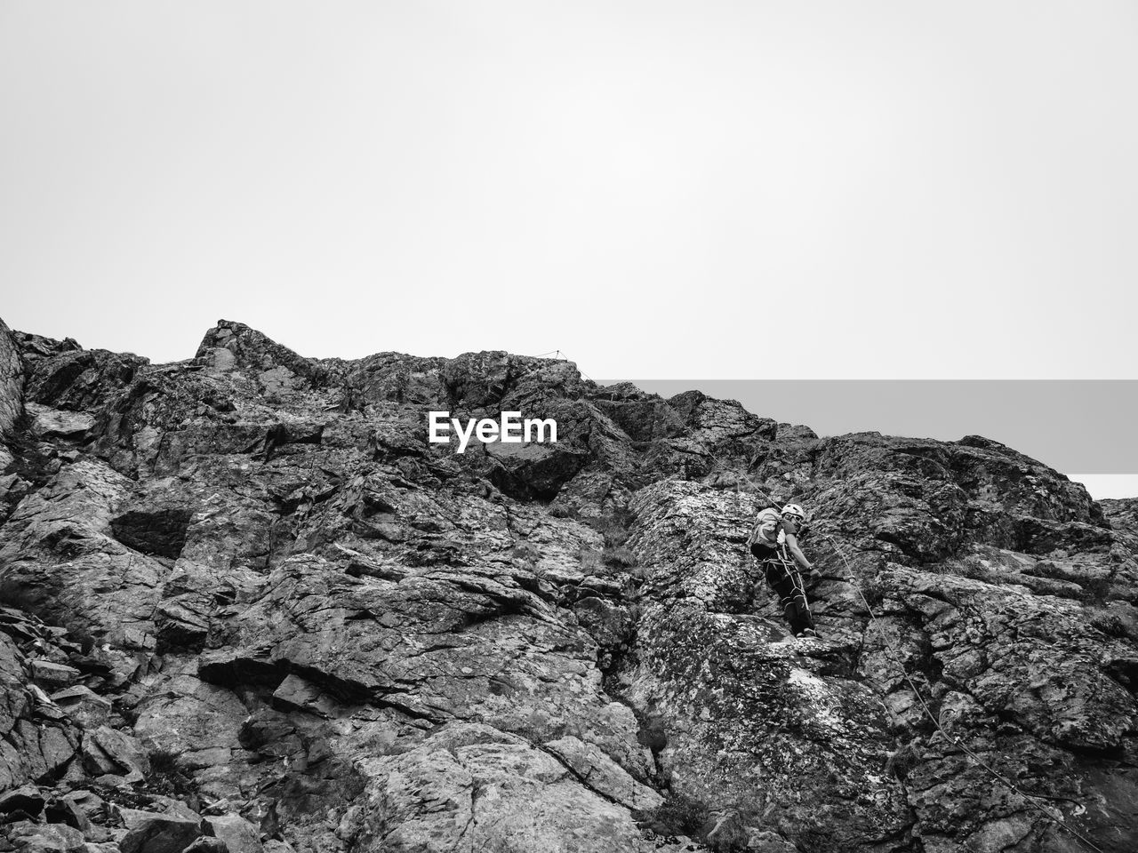 LOW ANGLE VIEW OF ROCK FORMATIONS AGAINST CLEAR SKY