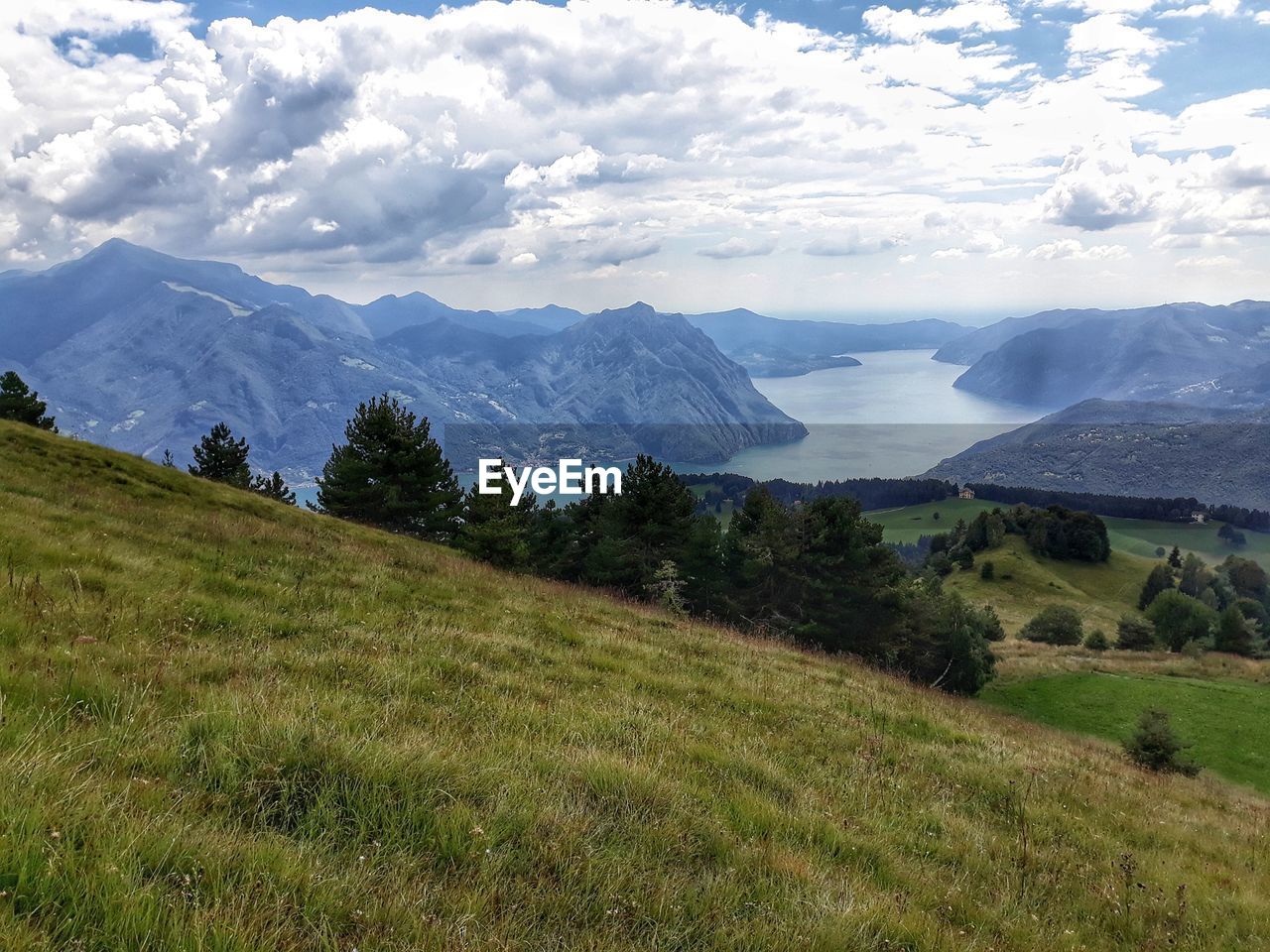 Scenic view of landscape and mountains against sky