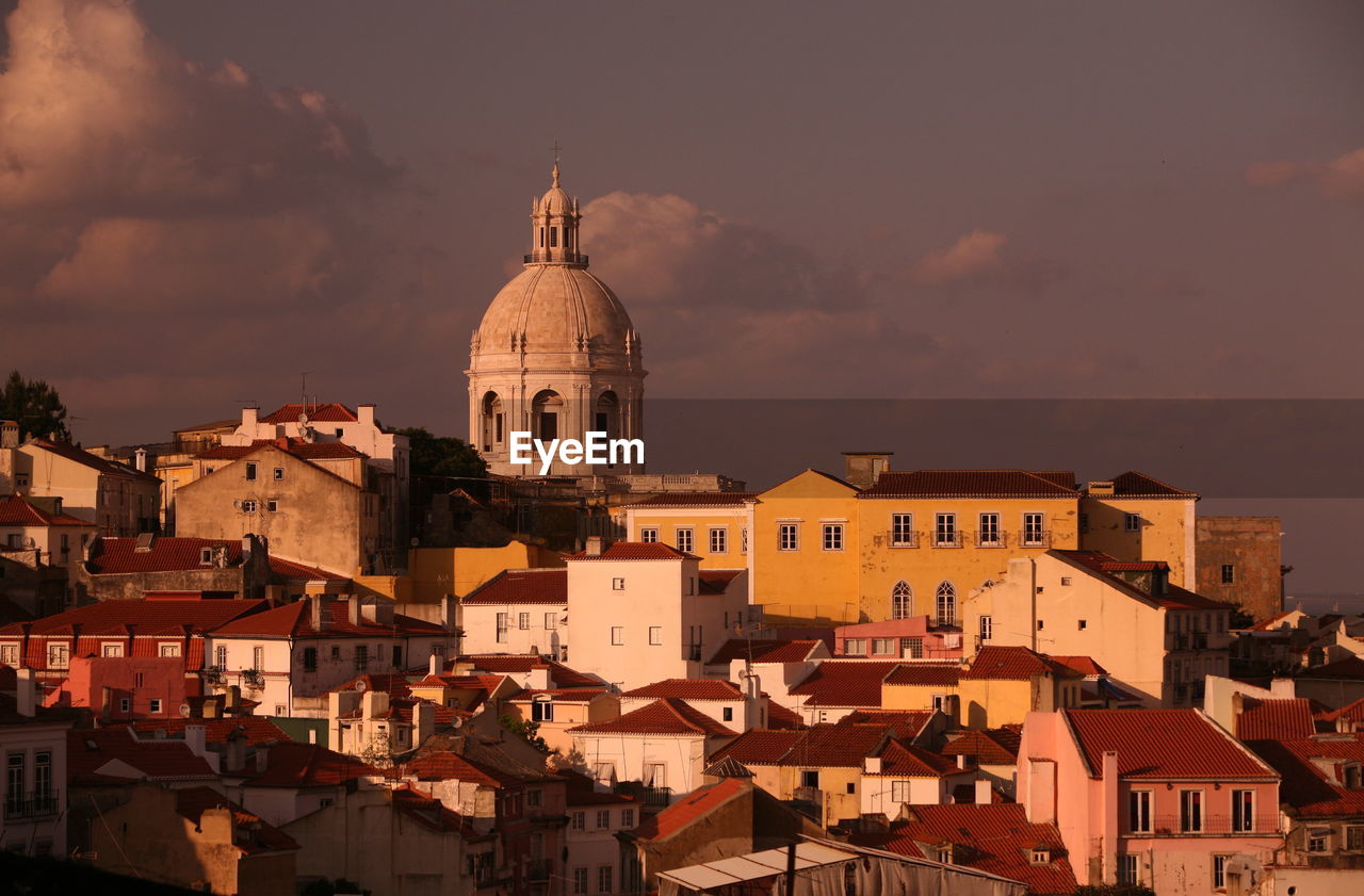 National pantheon by houses against sky