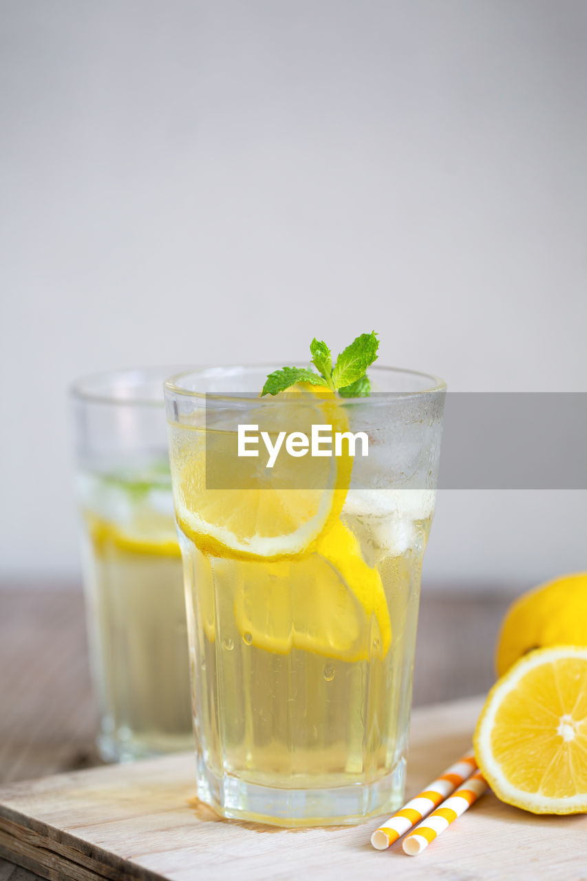 GLASS OF JUICE WITH DRINK IN GLASSES