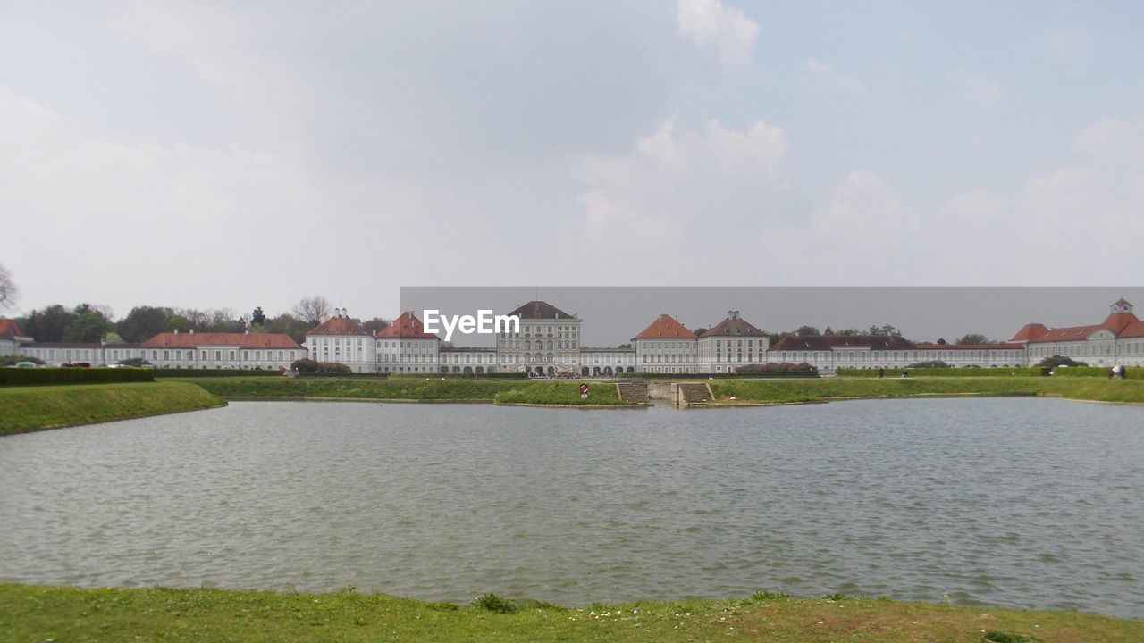 SCENIC VIEW OF RIVER AGAINST BUILDINGS