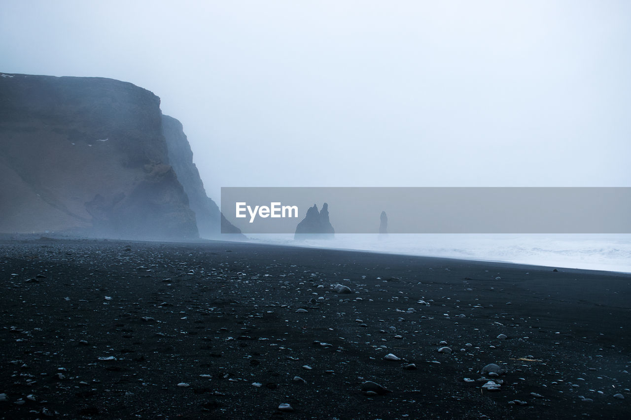 Scenic view of sea against sky during foggy weather